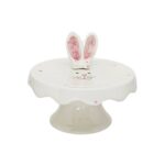 Boleira em cerâmica branca, com poá rosa claro com rostinho de coelho e orelha em 3D para locação. Festa com temas coelinho e páscoa